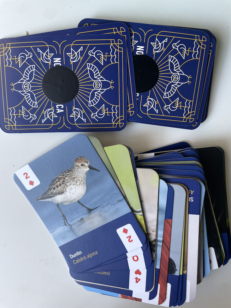 Photo of card deck, with NFC tag stickers on card backs