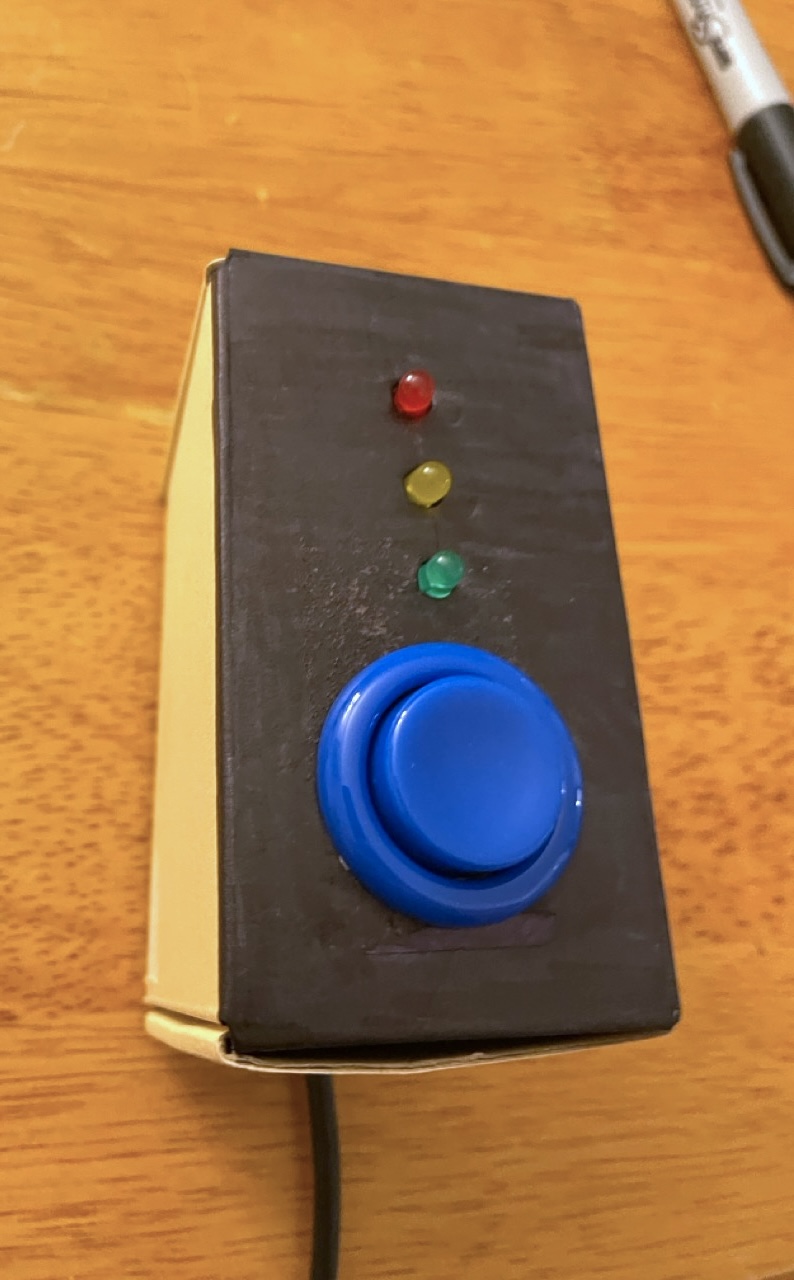 Close-up photo of timer box, with one button and three LEDs
