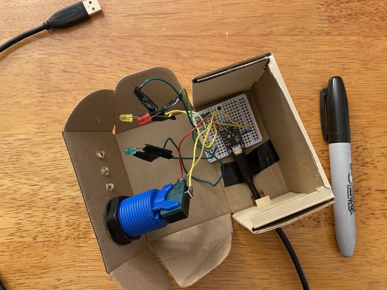 Photo of electronics in open cardboard box