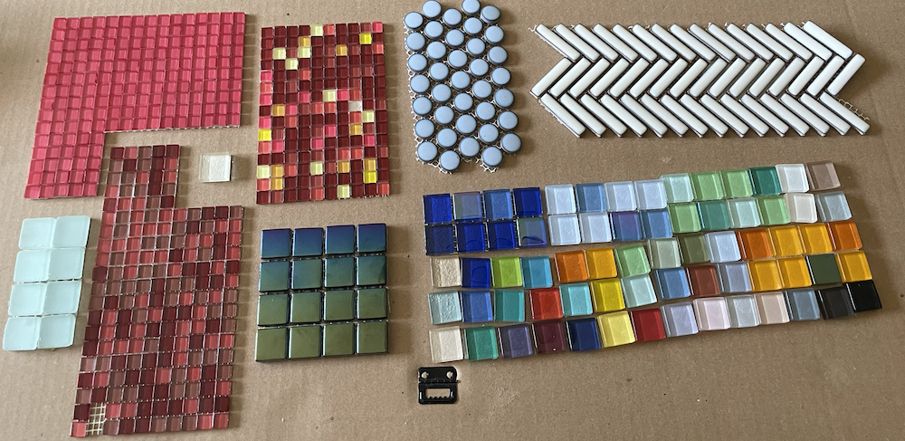 Another photo of glass tiles being removed from cardboard binder