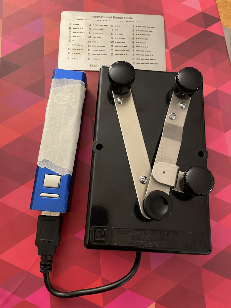 Photograph of telegraph key attached to USB power bank